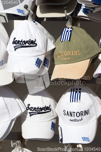 Image of souvenir hats sale display Santorini