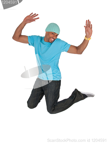 Image of Smiling guy in a blue t-shirt jumping for joy