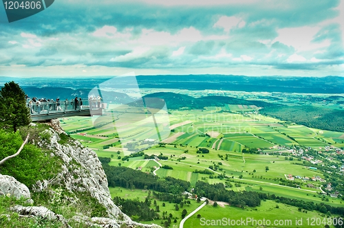 Image of Lookout point with green fields and mountains