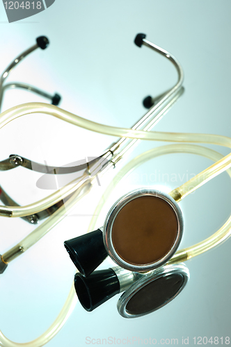 Image of stethoscope on a glass with reflection