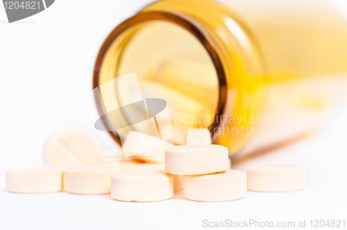 Image of Pills with bottle on isolated white background