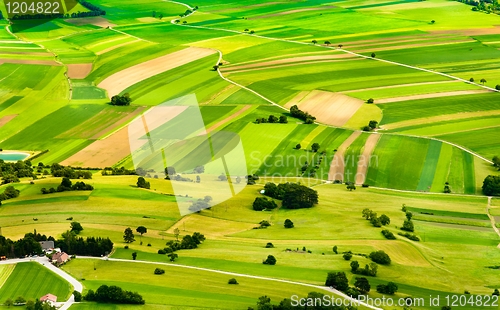 Image of aerial view of green fields and slopes