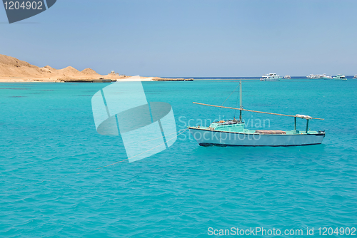 Image of Boat on blue sea water in Egypt