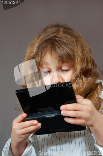 Image of kid playing computer game