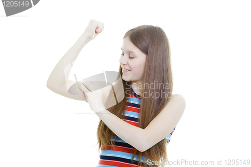 Image of smiling teenage girl measures her biceps