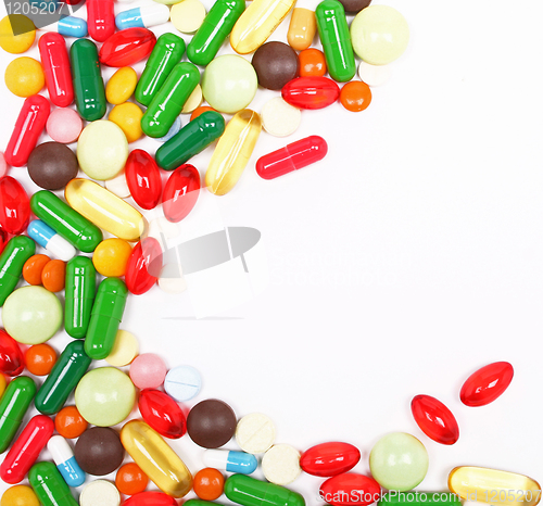 Image of Colorful pills on white background 