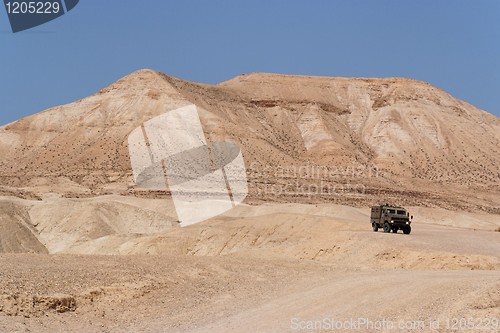 Image of Israeli army Humvee on patrol in the Judean desert 