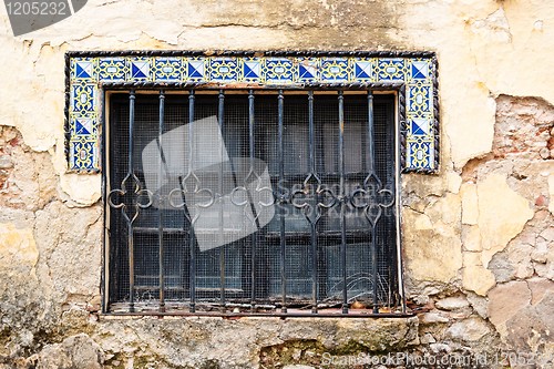 Image of Window of old house in Andalusia with Moorish style tiles