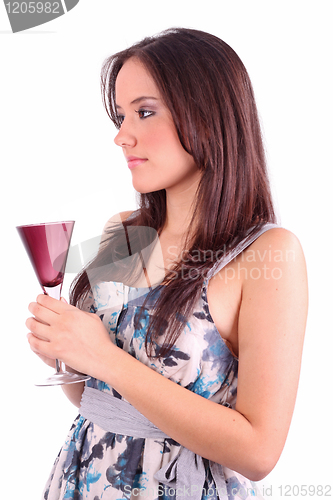 Image of young woman holding glass of martini