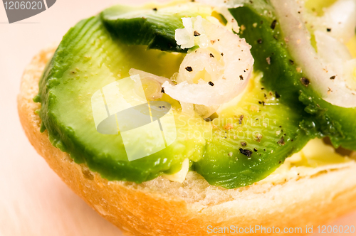 Image of Sandwich with avocado on a wooden board 