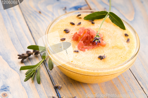 Image of fresh melon soup with parma ham and lavender flower