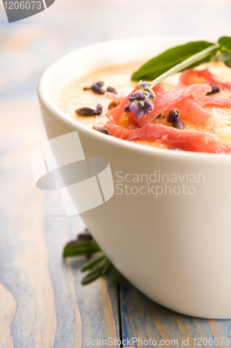 Image of fresh melon soup with parma ham and lavender flower