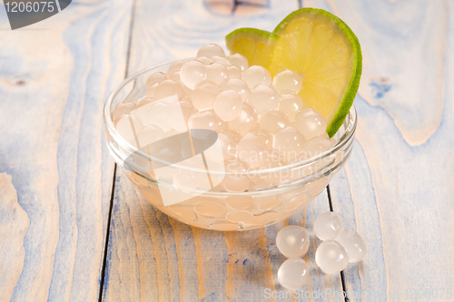 Image of tapioca pearls with lime. white bubble tea ingredients