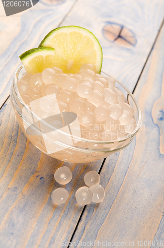 Image of tapioca pearls with lime. white bubble tea ingredients