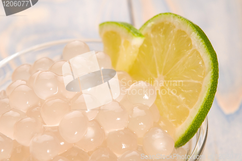 Image of tapioca pearls with lime. white bubble tea ingredients