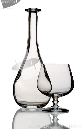 Image of Glass bottle and goblet, isolated.