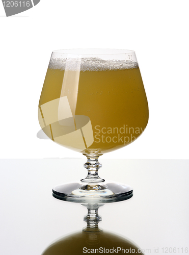 Image of Glass goblet with a juice, isolated.