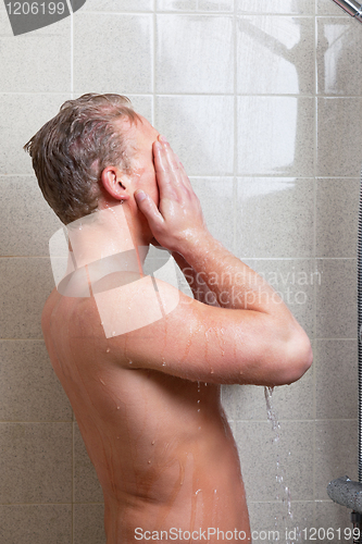 Image of Man having a shower