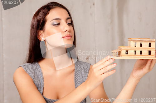 Image of Female Architect with House Model