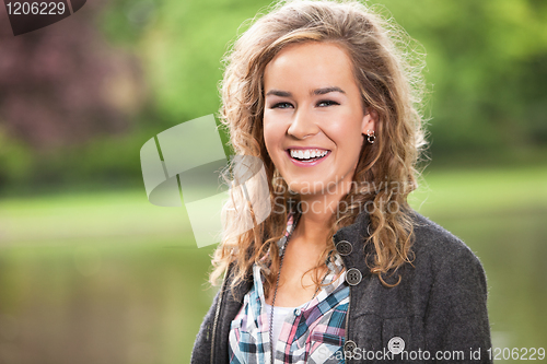 Image of Young female smiling outdoors