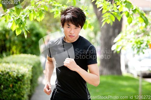 Image of Serious man jogging