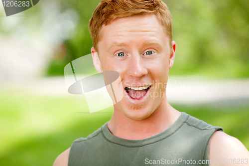 Image of Portrait of excited man with mouth open