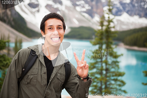 Image of Male hiker showing you the 'V' sign
