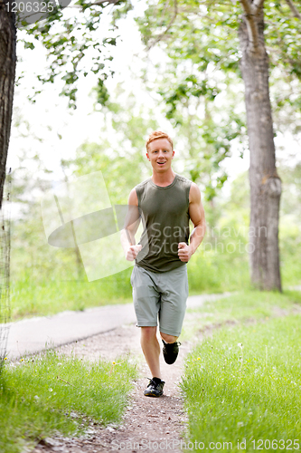 Image of Young man jogging