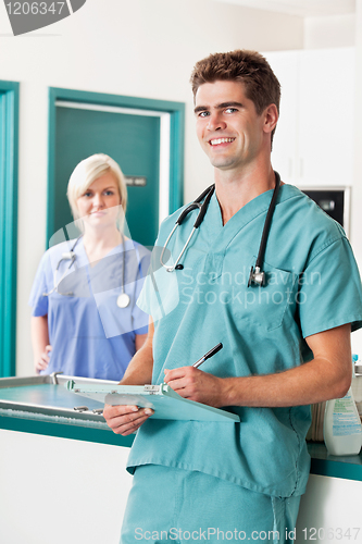 Image of Male veterinarian with clipboard
