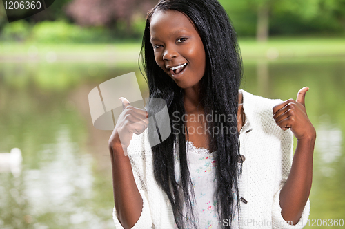 Image of Young woman wishing you luck