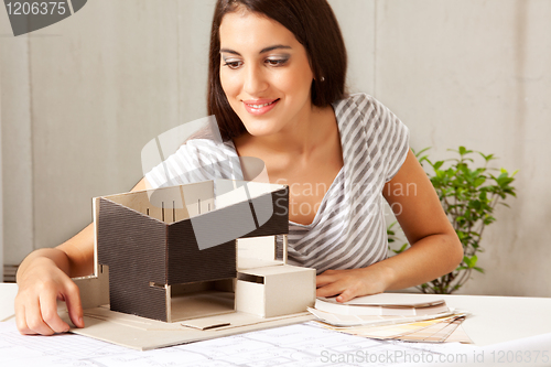 Image of Architect with Blue Prints and Model