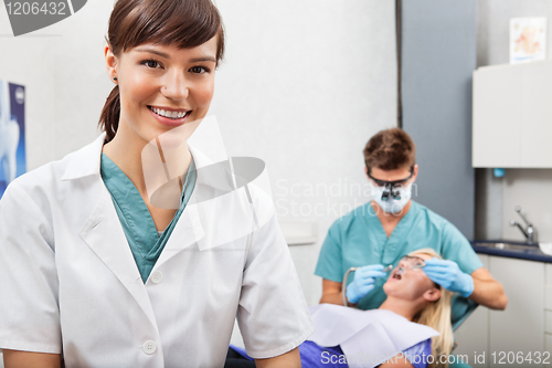 Image of Assistant with dentistry work in the background