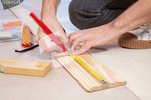 Image of Cropped hand of a carpenter