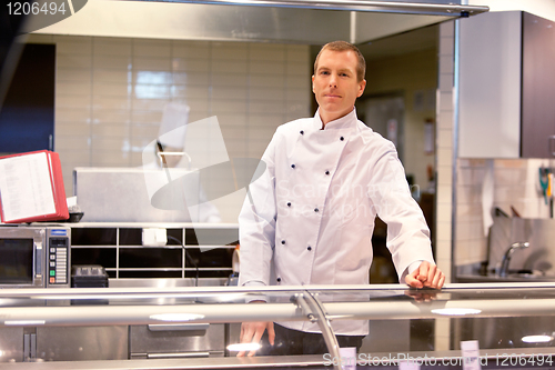 Image of Butcher in Grocery Store