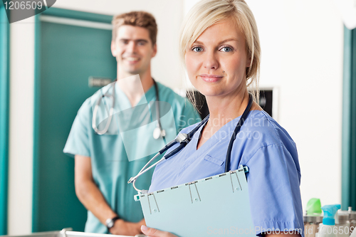 Image of Confident female and male veterinarian