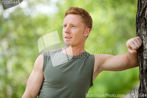 Image of Man smiling and looking away