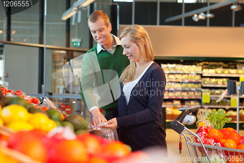 Image of Smiling couple in shopping store