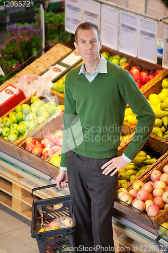 Image of Portrait of serious man in shopping centre