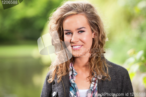 Image of Happy blond female smiling