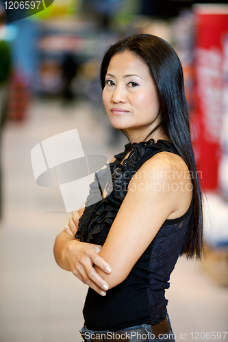 Image of Asian Woman Standing in Supermarket