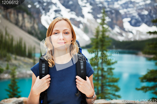 Image of Female hiker with her backpack against scenic view