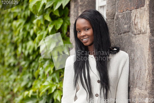 Image of African American women in front of stone wall