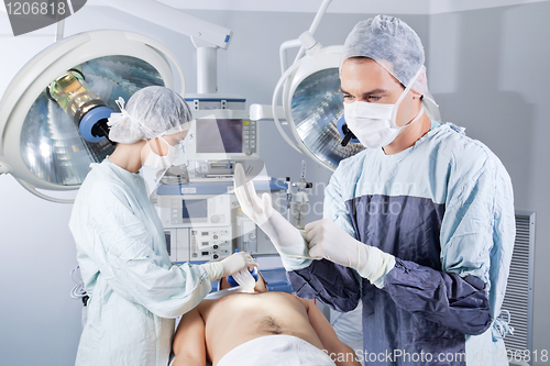 Image of Doctor preparing for surgery
