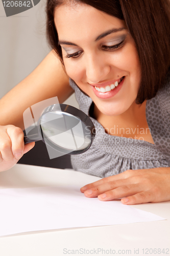 Image of Woman with Magnifying Glass