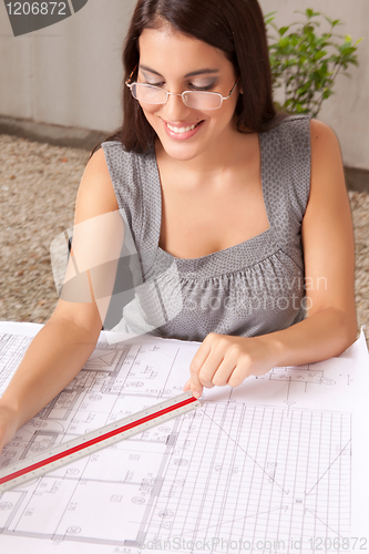 Image of Architect Checking Blueprints