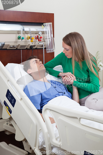 Image of Man on a hospital bed