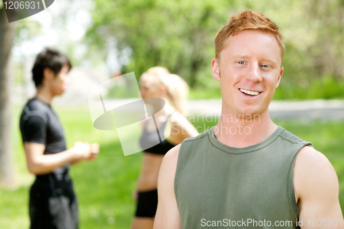 Image of Portrait of a man with friends in the background