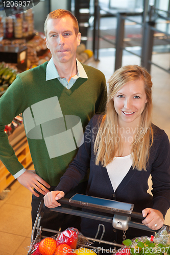 Image of Happy Couple Buying Groceries