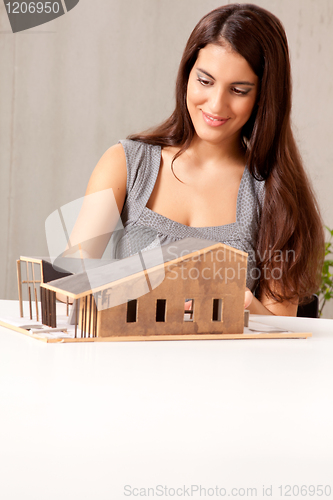Image of Female Architect with House Model