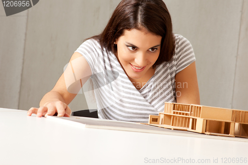 Image of Architect Examining Model